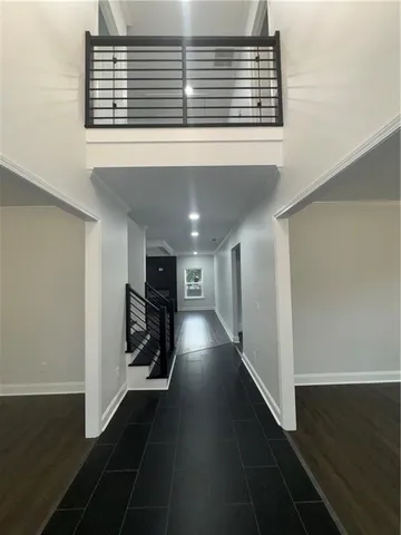 a view of a livingroom with hardwood floor and a ceiling fan