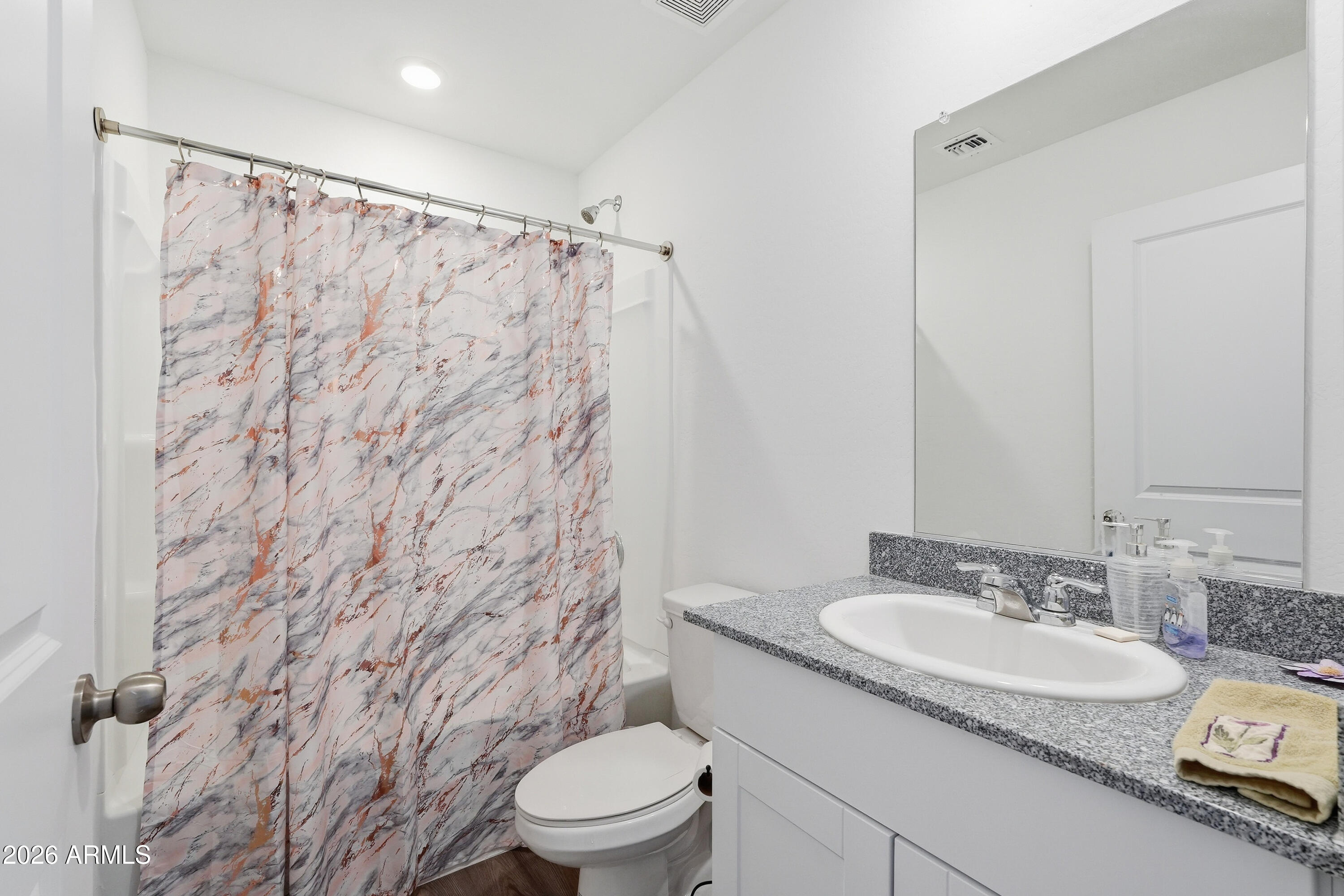 15610 South Moon Valley Road Arizona City, AZ 85123 - Photo 29 of 36 a bathroom with a granite countertop sink toilet and shower