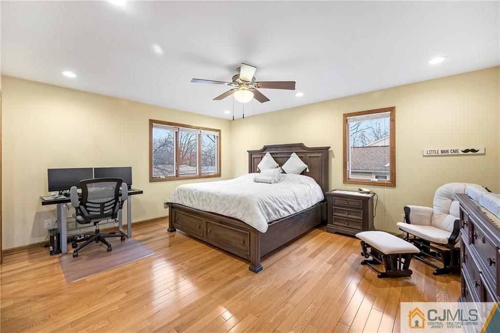 41 Ferris Road Edison, NJ 08817 - Photo 22 of 33 a bedroom with a bed a table and chair