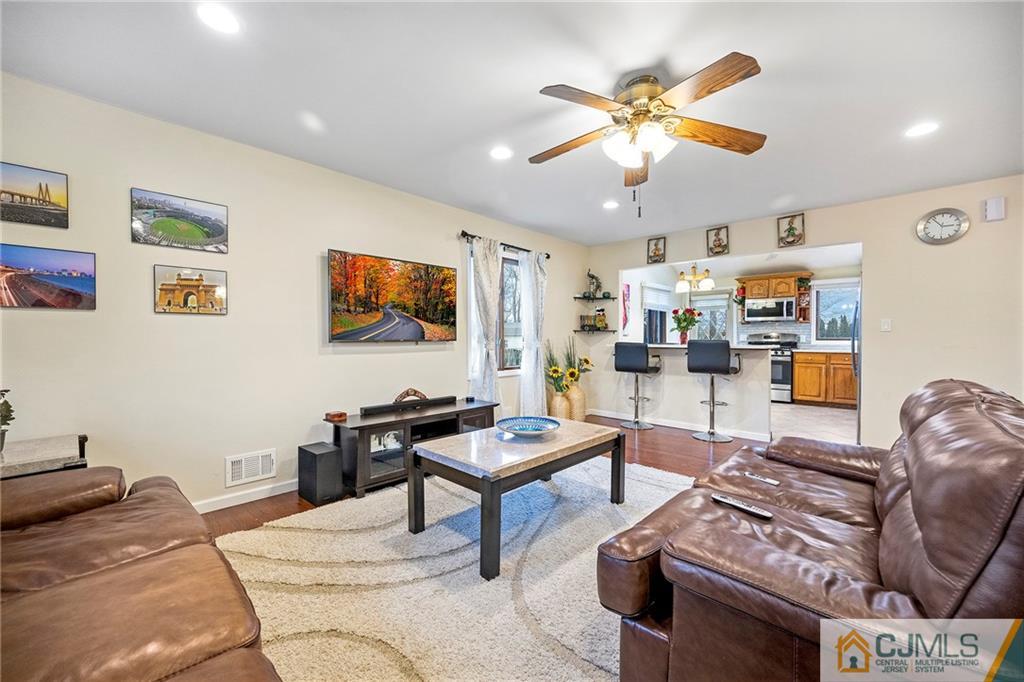 41 Ferris Road Edison, NJ 08817 - Photo 4 of 33 a living room with furniture and a ceiling fan