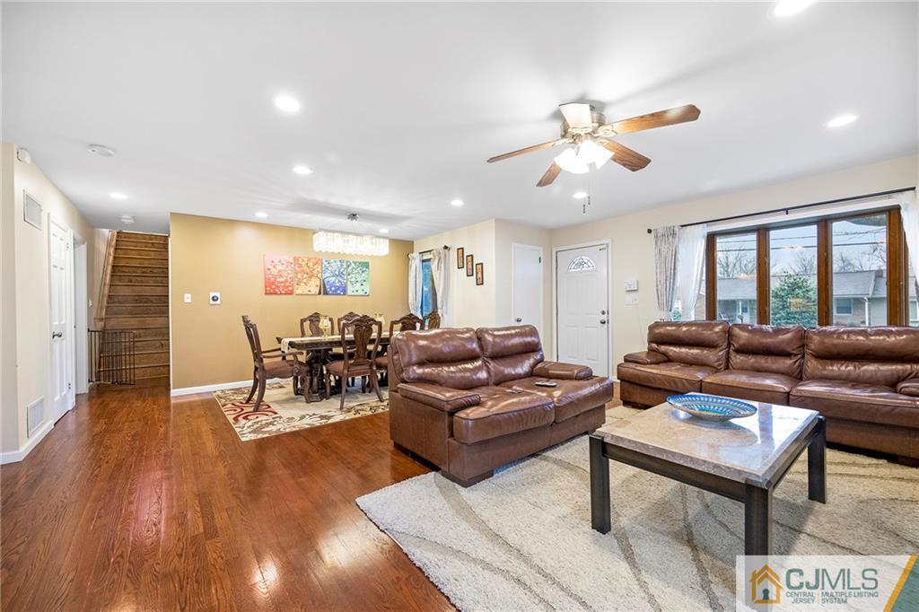 41 Ferris Road Edison, NJ 08817 - Photo 9 of 33 a living room with furniture a wooden floor and a window