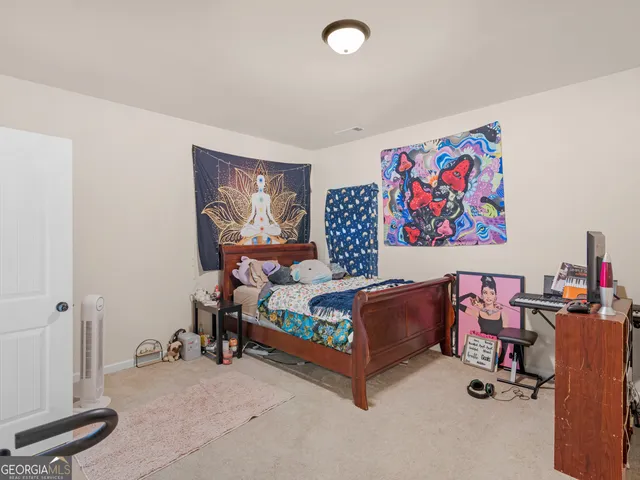 a bedroom with furniture and a bed