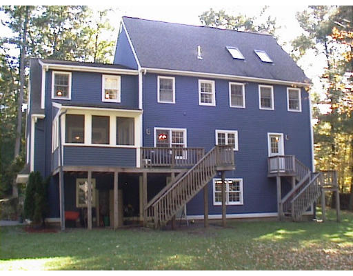 39 Wilson Pond Road Rowley, MA 01969 - Photo 3 of 15 front view of a house with a yard