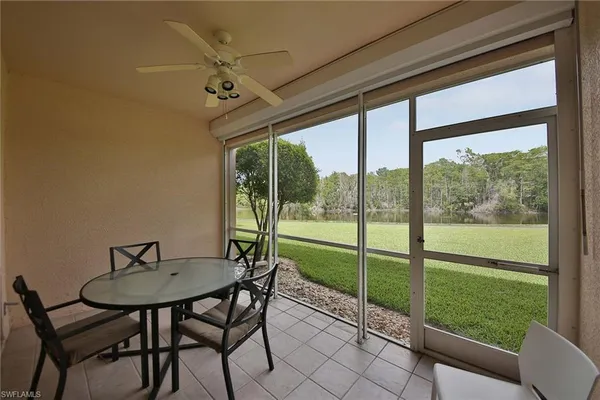 a view of a room that has a table and chairs in it