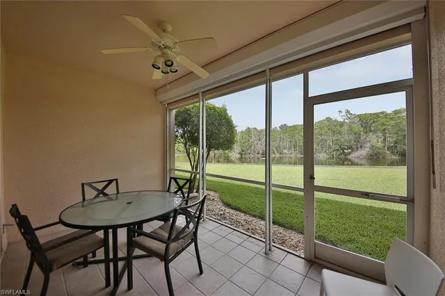 a view of a room that has a table and chairs in it