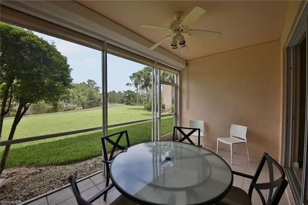 a view of a porch with furniture and yard
