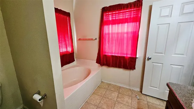 a bathroom with a sink double vanity and shower