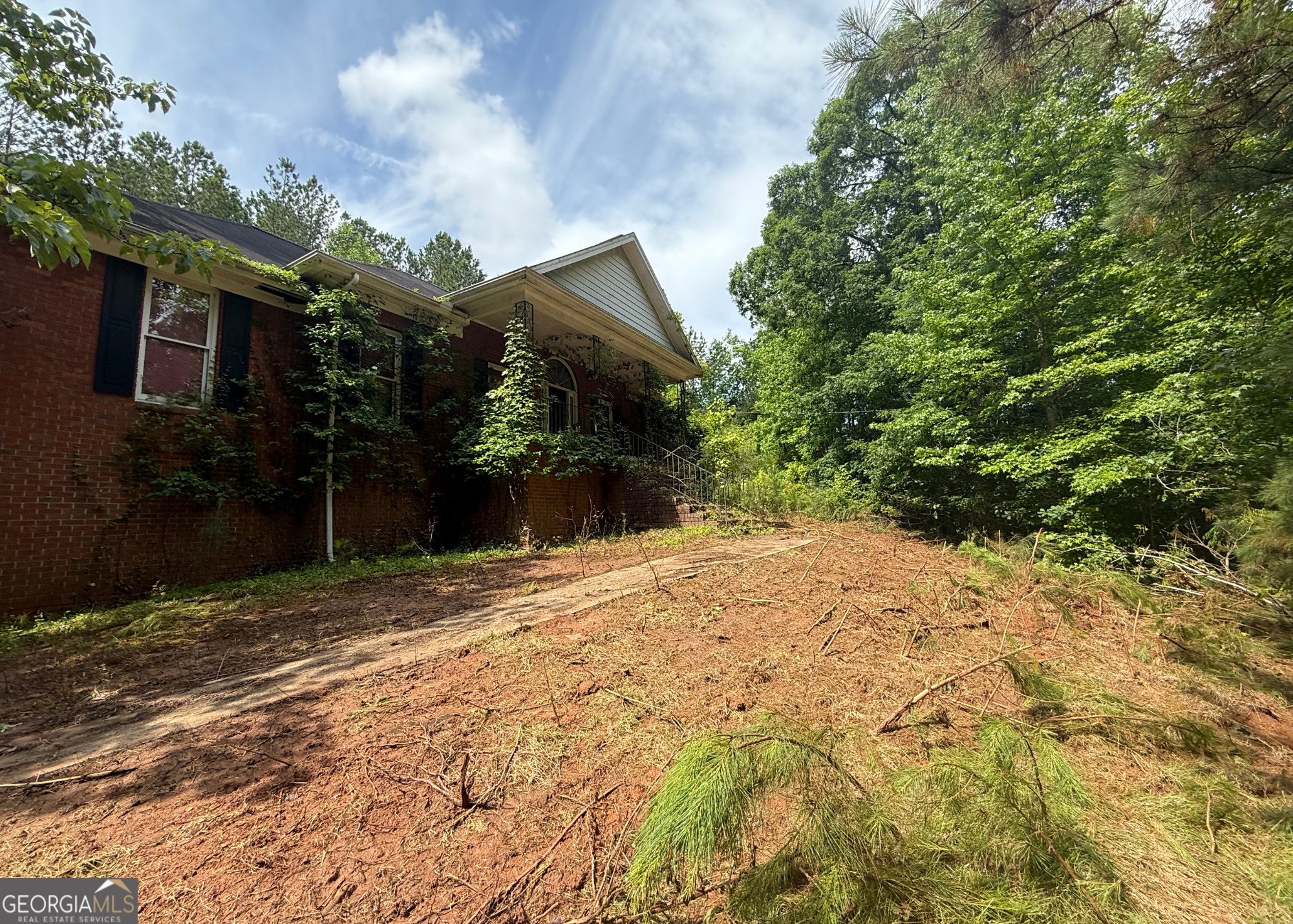 8872 Conners Road Villa Rica, GA 30180 - Photo 2 of 20 a view of a backyard of the house