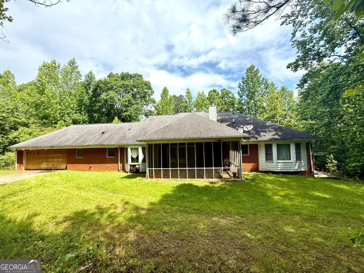 8872 Conners Road Villa Rica, GA 30180 - Photo 5 of 20 a view of a house with a yard and sitting area