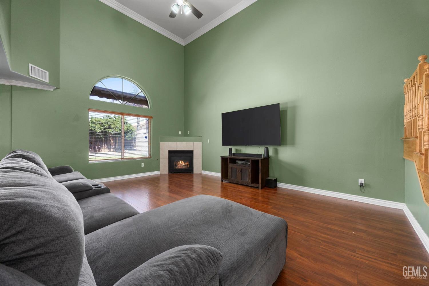Undisclosed Address Bakersfield, CA 93313 - Photo 14 of 48 a living room with furniture a fireplace and a flat screen tv