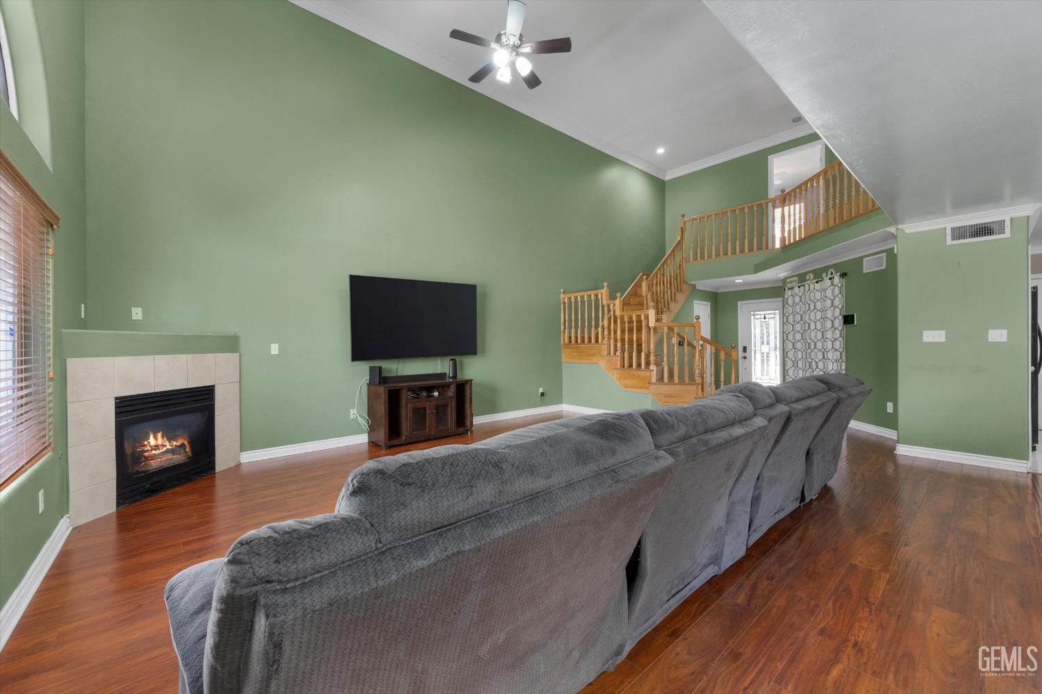Undisclosed Address Bakersfield, CA 93313 - Photo 18 of 48 a living room with furniture a fireplace and a flat screen tv