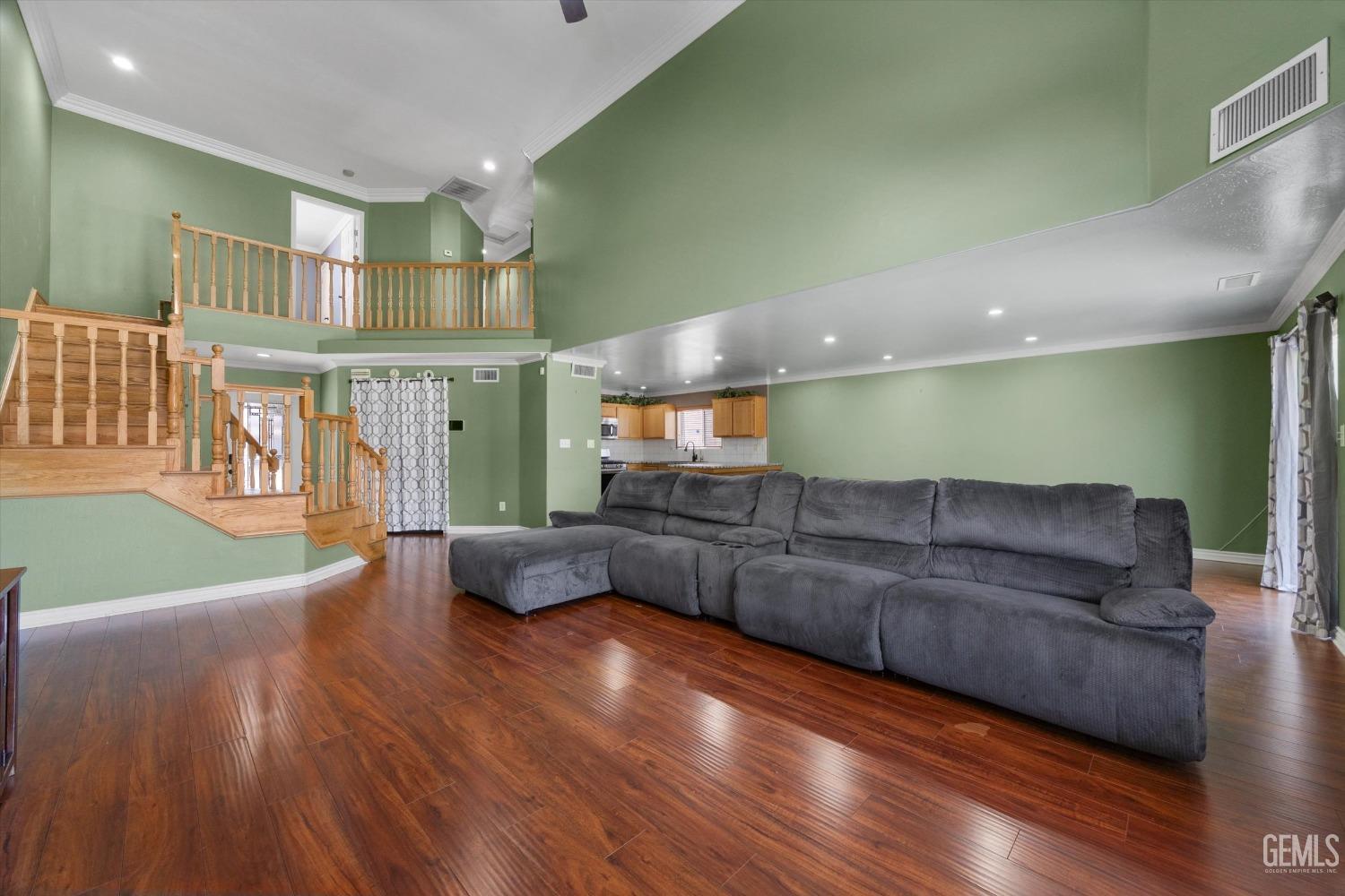 Undisclosed Address Bakersfield, CA 93313 - Photo 19 of 48 a living room with furniture and a wooden floor