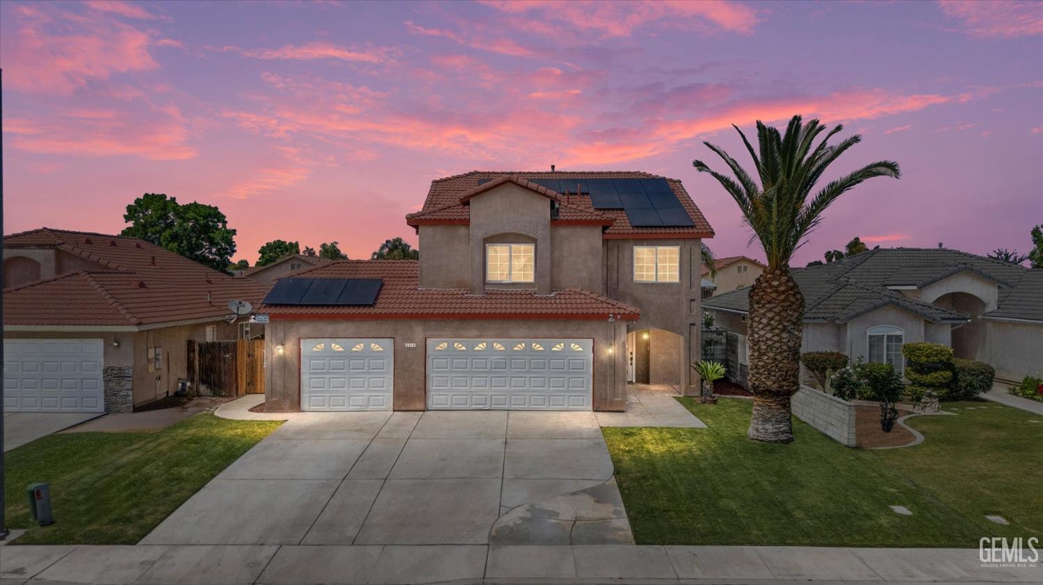 Undisclosed Address Bakersfield, CA 93313 - Photo 2 of 48 a front view of a house with garden
