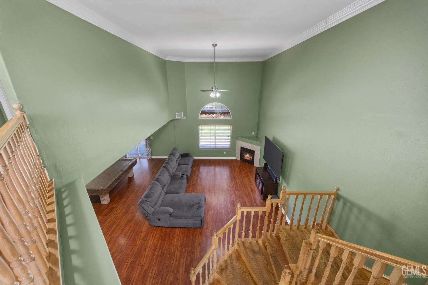 Undisclosed Address Bakersfield, CA 93313 - Photo 29 of 48 a view of stairs and dining room with wooden floor
