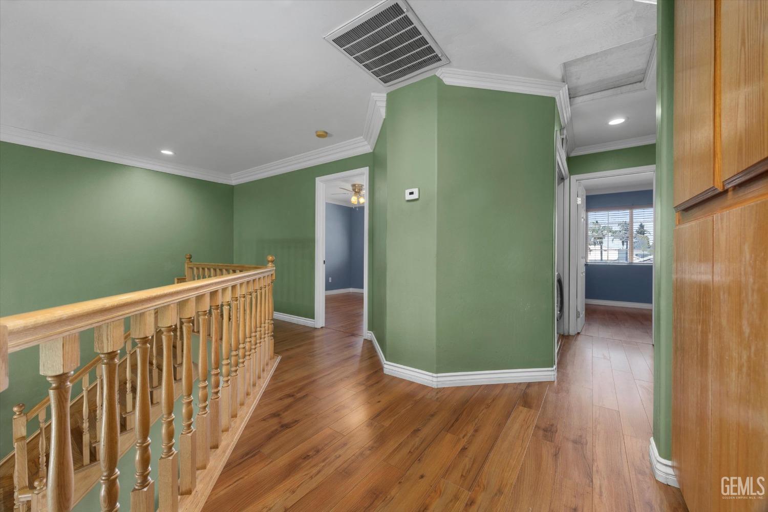 Undisclosed Address Bakersfield, CA 93313 - Photo 30 of 48 a view of a hallway with wooden floor