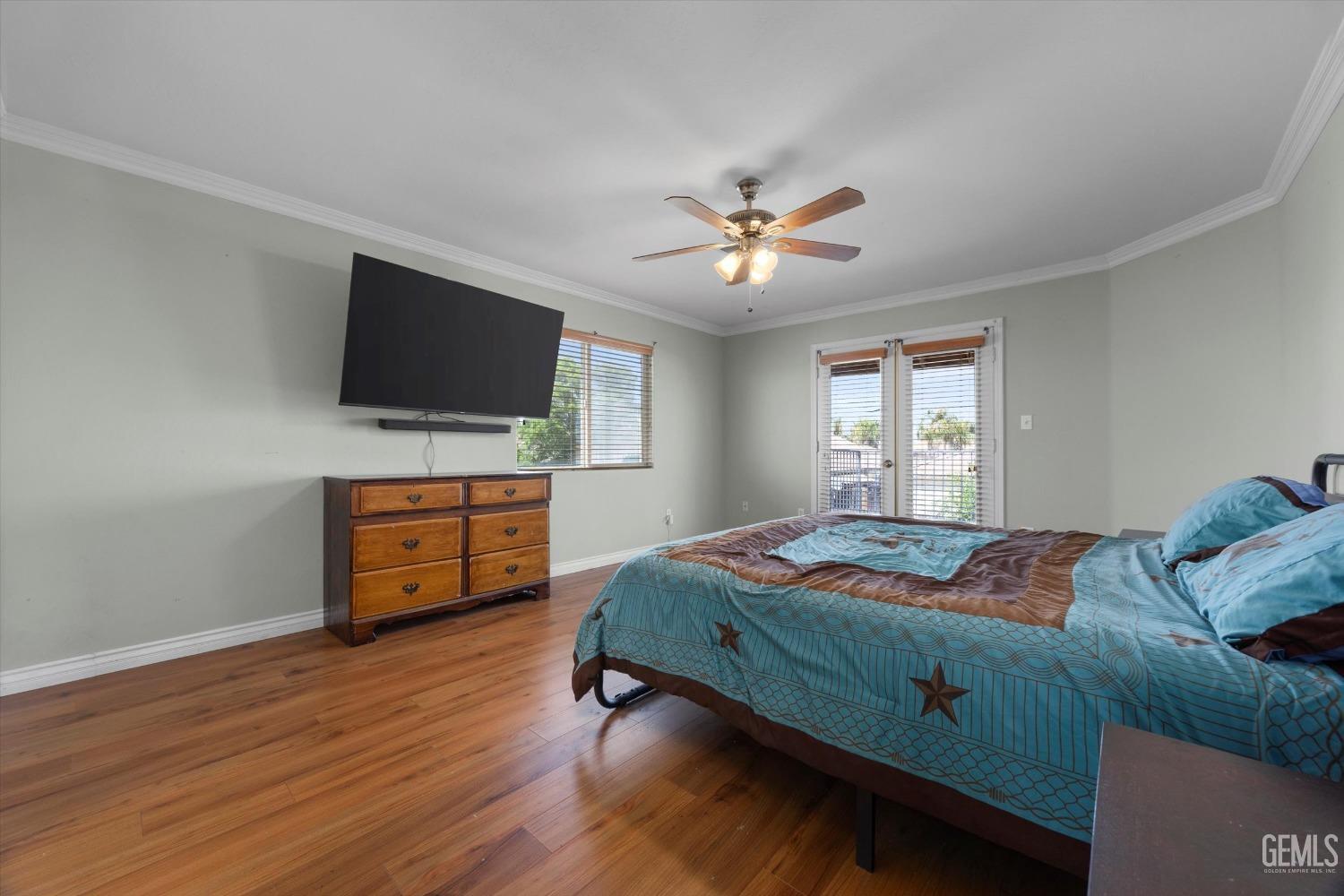 Undisclosed Address Bakersfield, CA 93313 - Photo 31 of 48 a bedroom with a bed and a flat screen tv