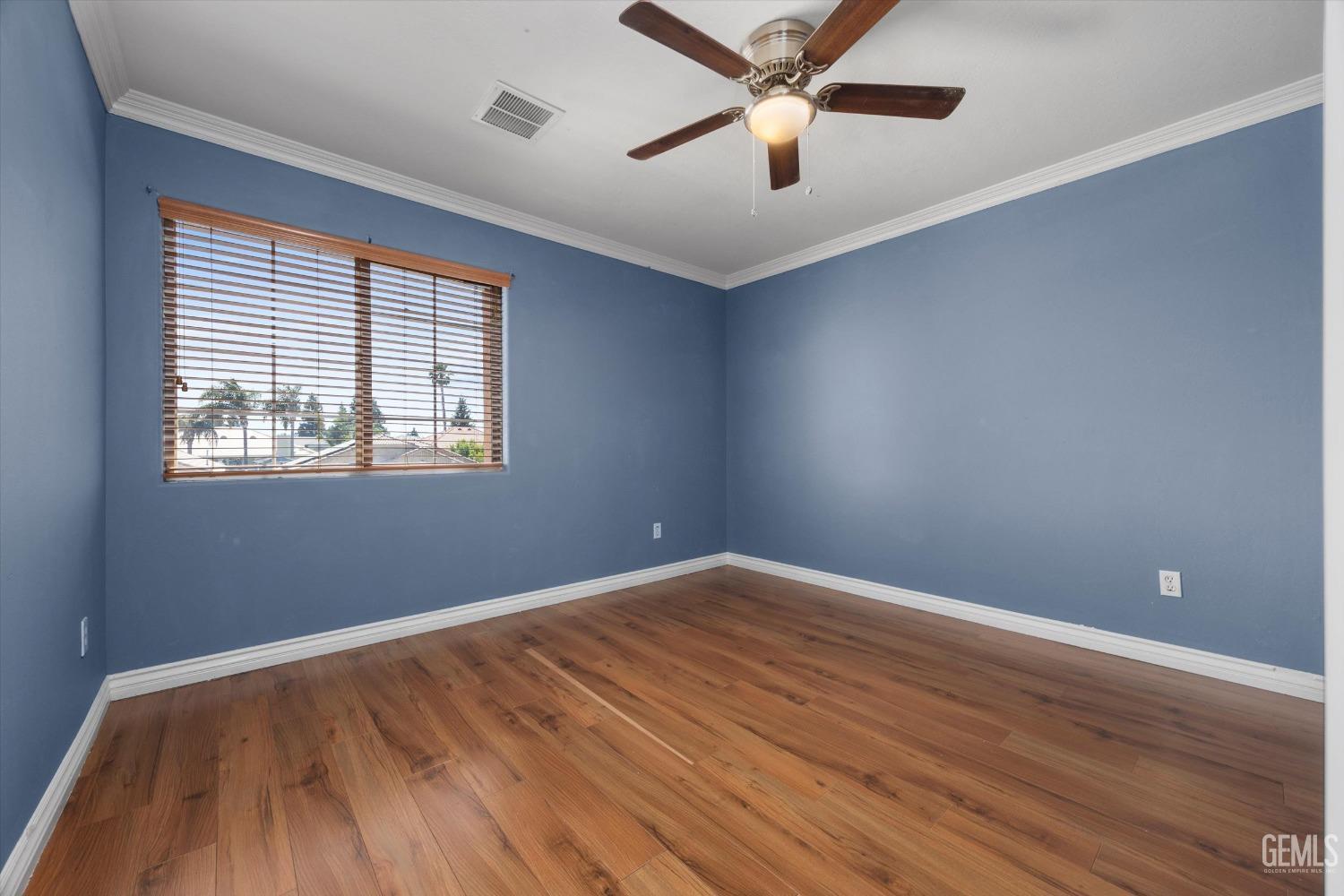 Undisclosed Address Bakersfield, CA 93313 - Photo 37 of 48 wooden floor in an empty room with a window