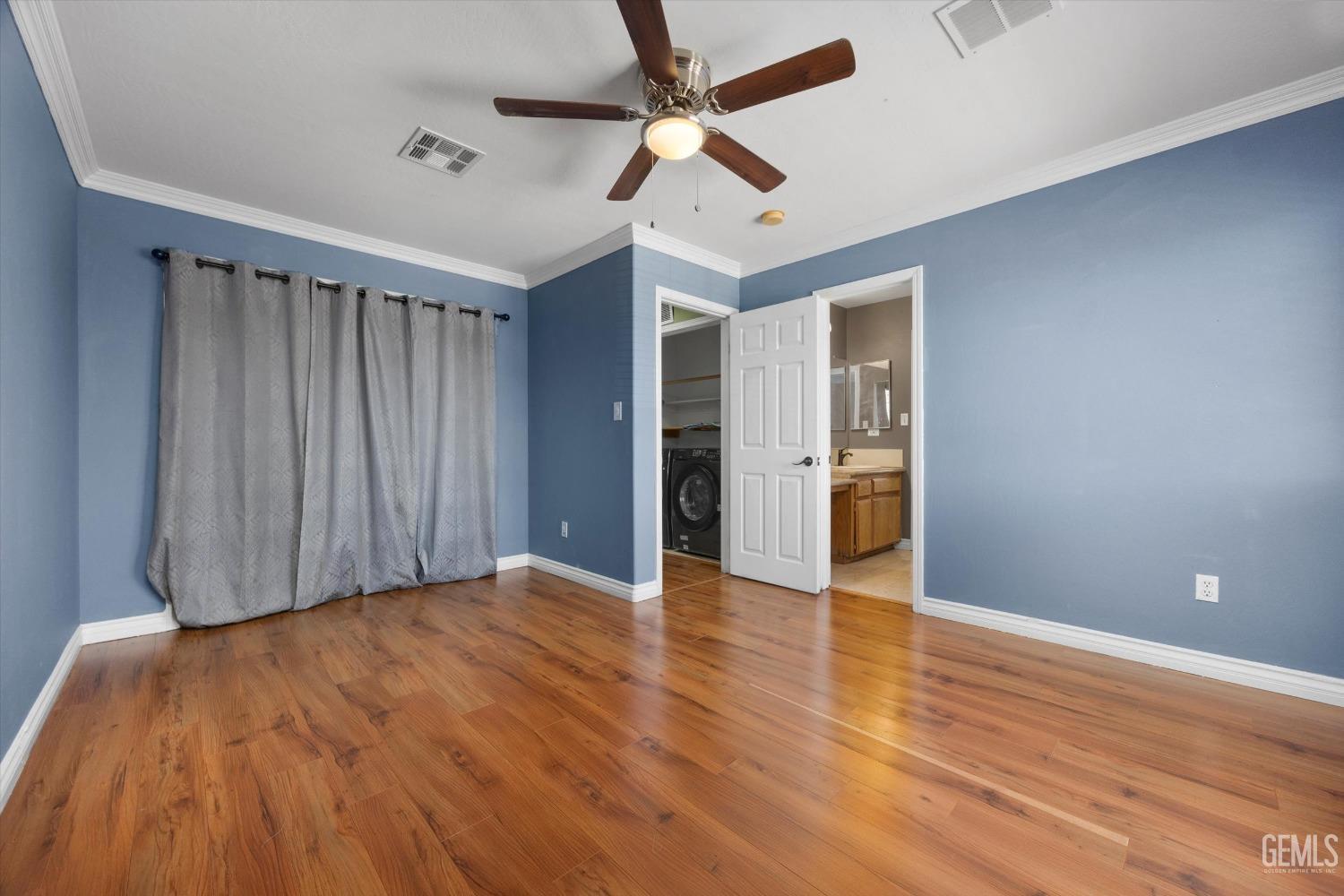 Undisclosed Address Bakersfield, CA 93313 - Photo 38 of 48 a view of an empty room with wooden floor
