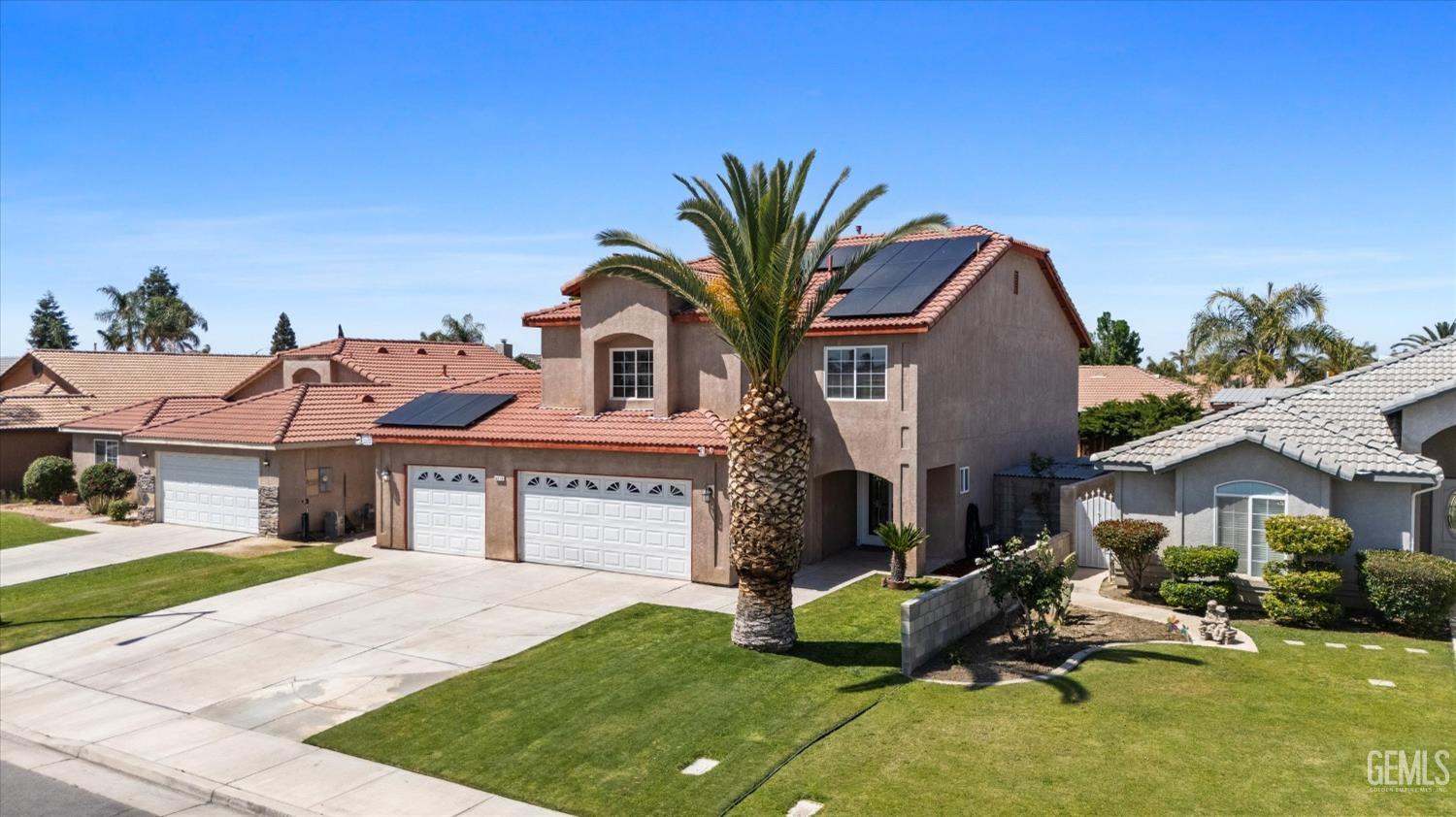 Undisclosed Address Bakersfield, CA 93313 - Photo 4 of 48 a front view of a house with garden