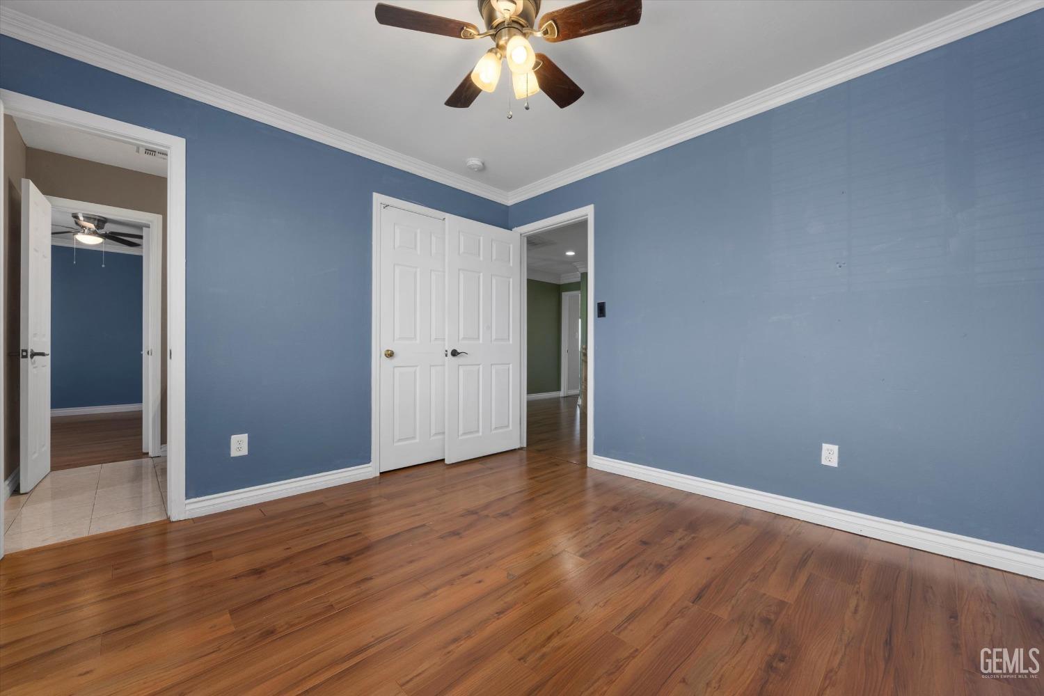 Undisclosed Address Bakersfield, CA 93313 - Photo 42 of 48 wooden floor in an empty room with a window