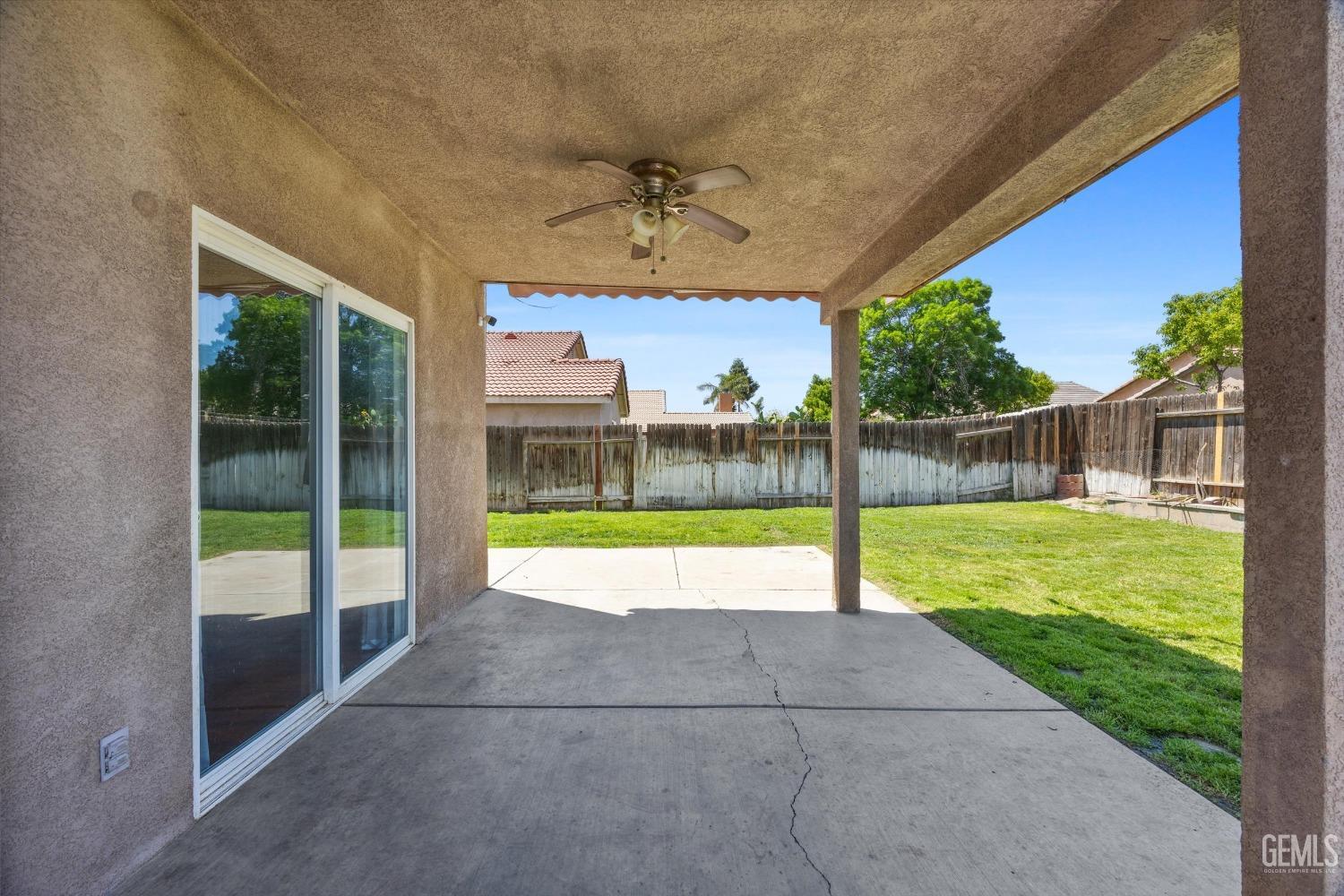 Undisclosed Address Bakersfield, CA 93313 - Photo 44 of 48 a view of a house with a backyard