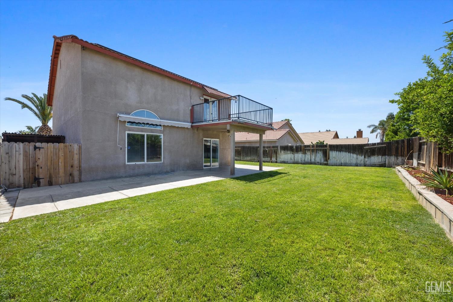 Undisclosed Address Bakersfield, CA 93313 - Photo 48 of 48 a view of a house with a yard and sitting area