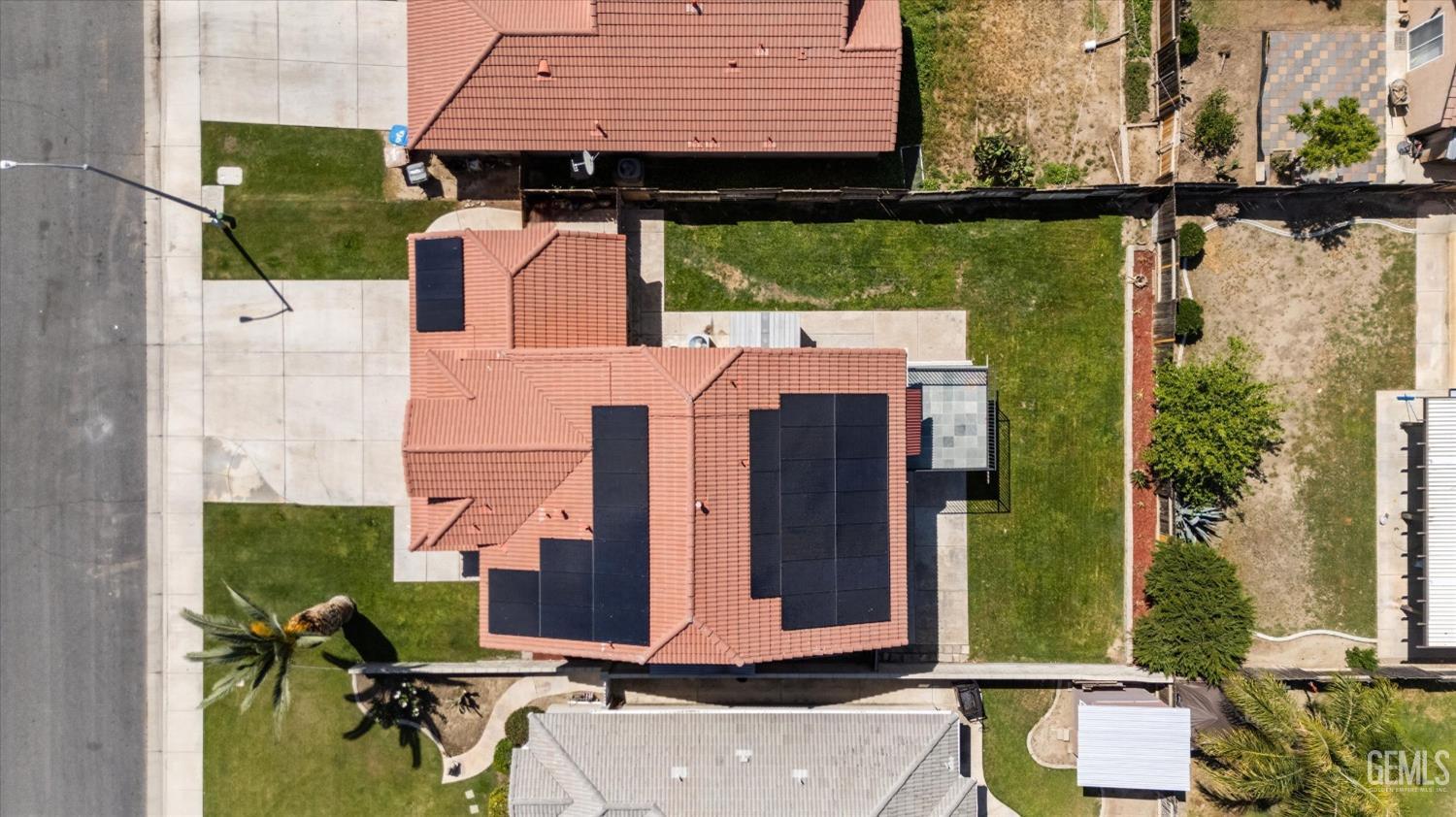 Undisclosed Address Bakersfield, CA 93313 - Photo 8 of 48 an aerial view of a house with a yard