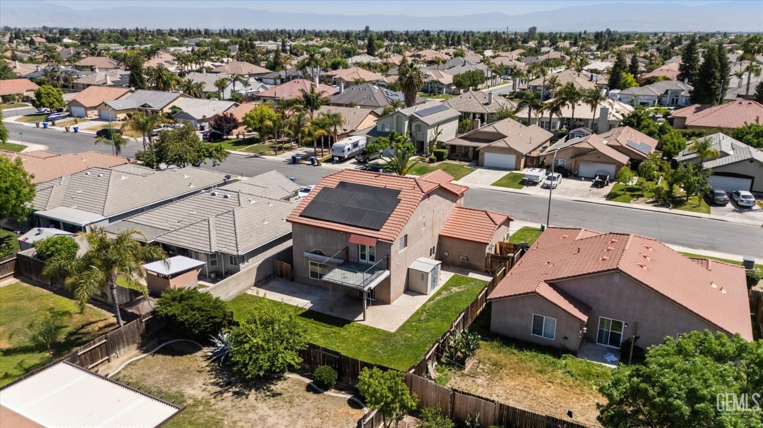 Undisclosed Address Bakersfield, CA 93313 - Photo 10 of 48 an aerial view of a house with a garden