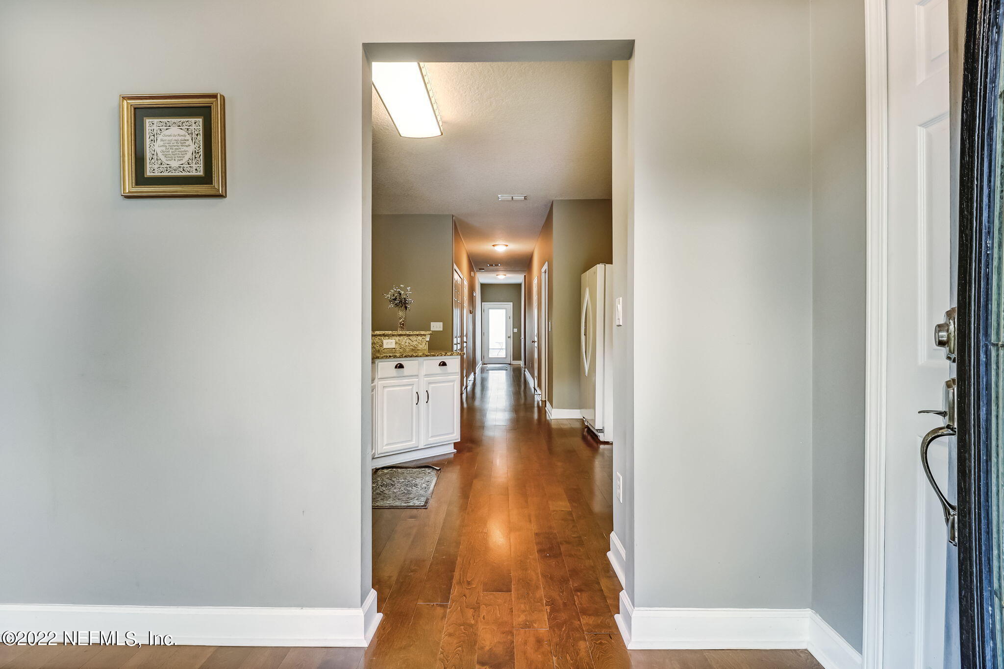 3154 Ravines Road Middleburg, FL 32068 - Photo 7 of 47 a view of a hallway with wooden floor