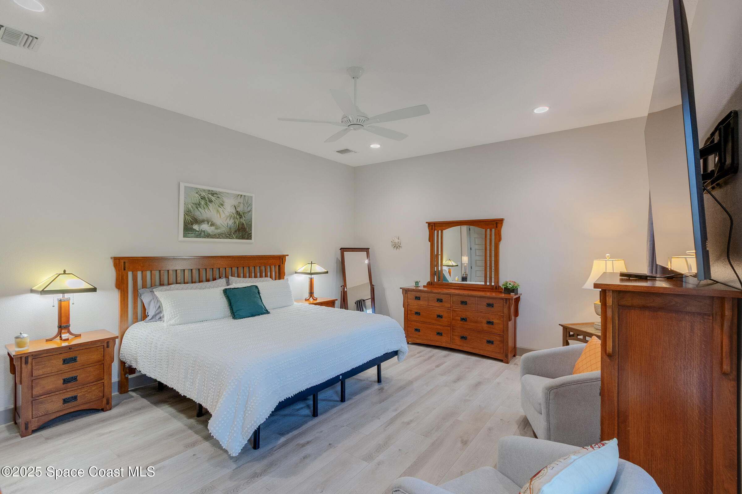 300 Pinto Lane Palm Bay, FL 32909 - Photo 20 of 70 a bedroom with a bed and wooden floor