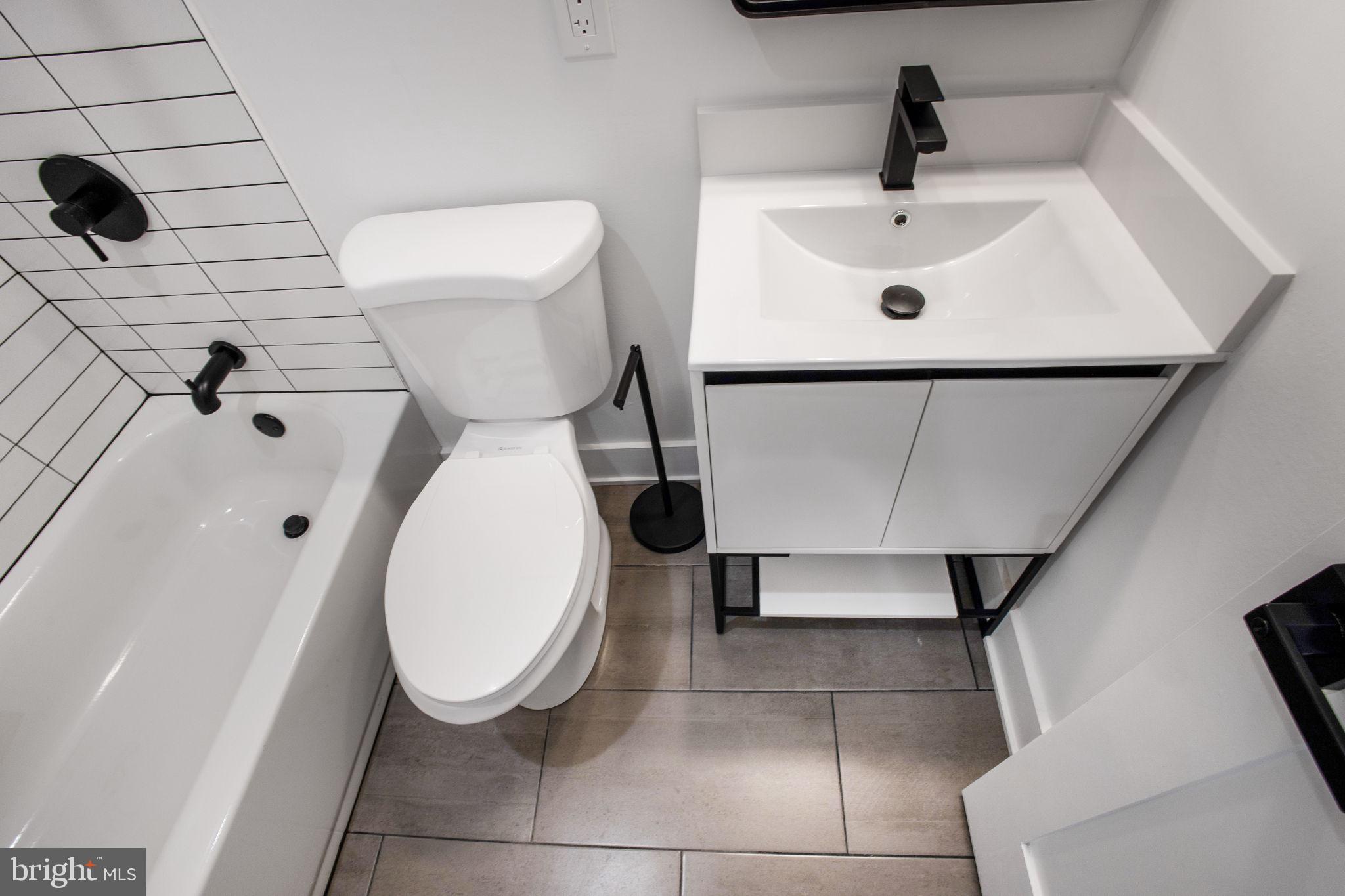 1211 Rhode Island Avenue Northwest, Unit 1 Washington, DC 20005 - Photo 15 of 24 a bathroom with a sink and a toilet