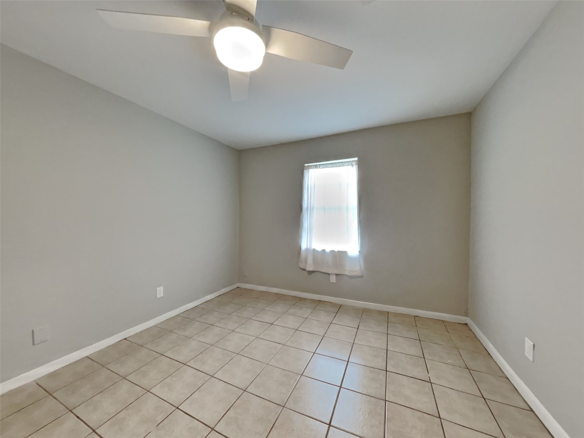 10648 Fussel Road, Unit A Conroe, TX 77385 - Photo 13 of 18 an empty room with a empty space and a window