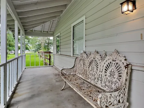 a view of a porch with furniture