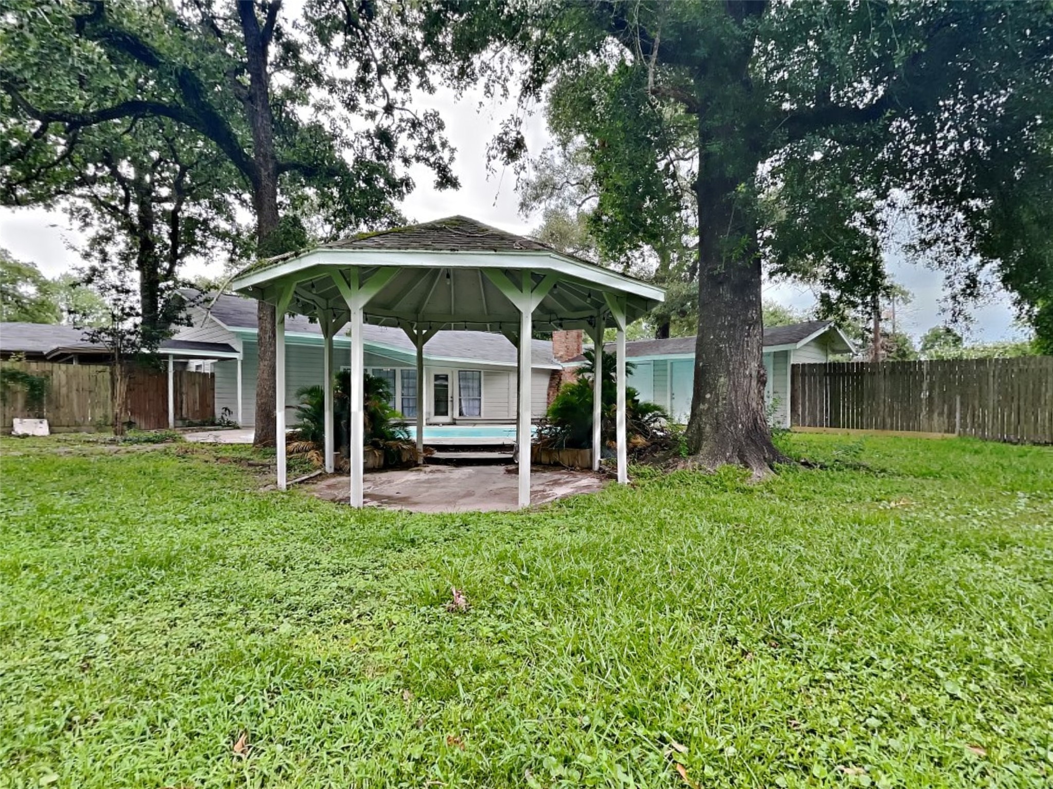 10648 Fussel Road, Unit A Conroe, TX 77385 - Photo 18 of 18 a view of a house with a yard and sitting area