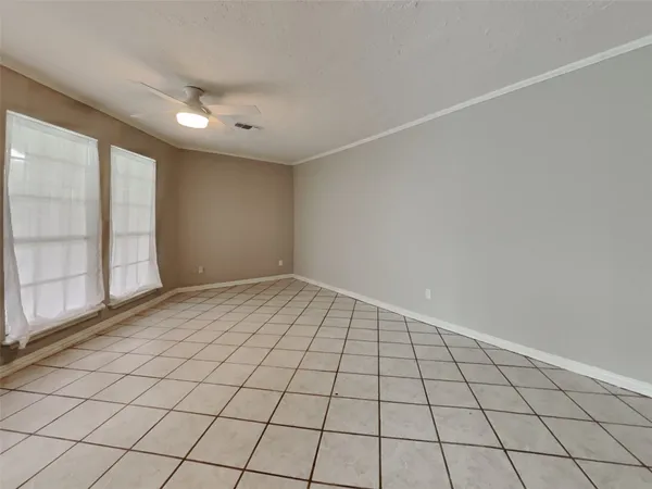 a view of an empty room and window
