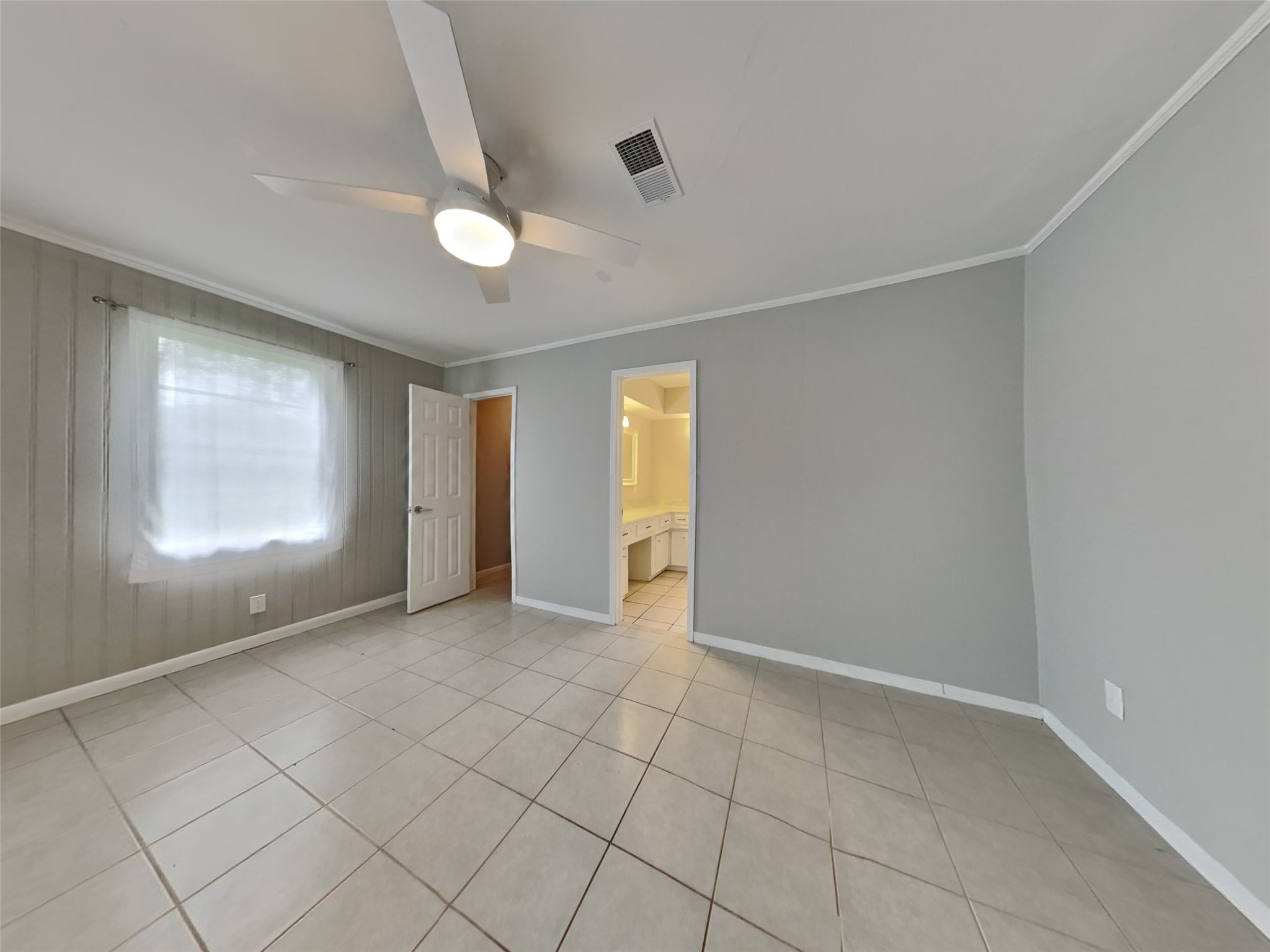 10648 Fussel Road, Unit A Conroe, TX 77385 - Photo 6 of 18 a view of an empty room with window and cabinet