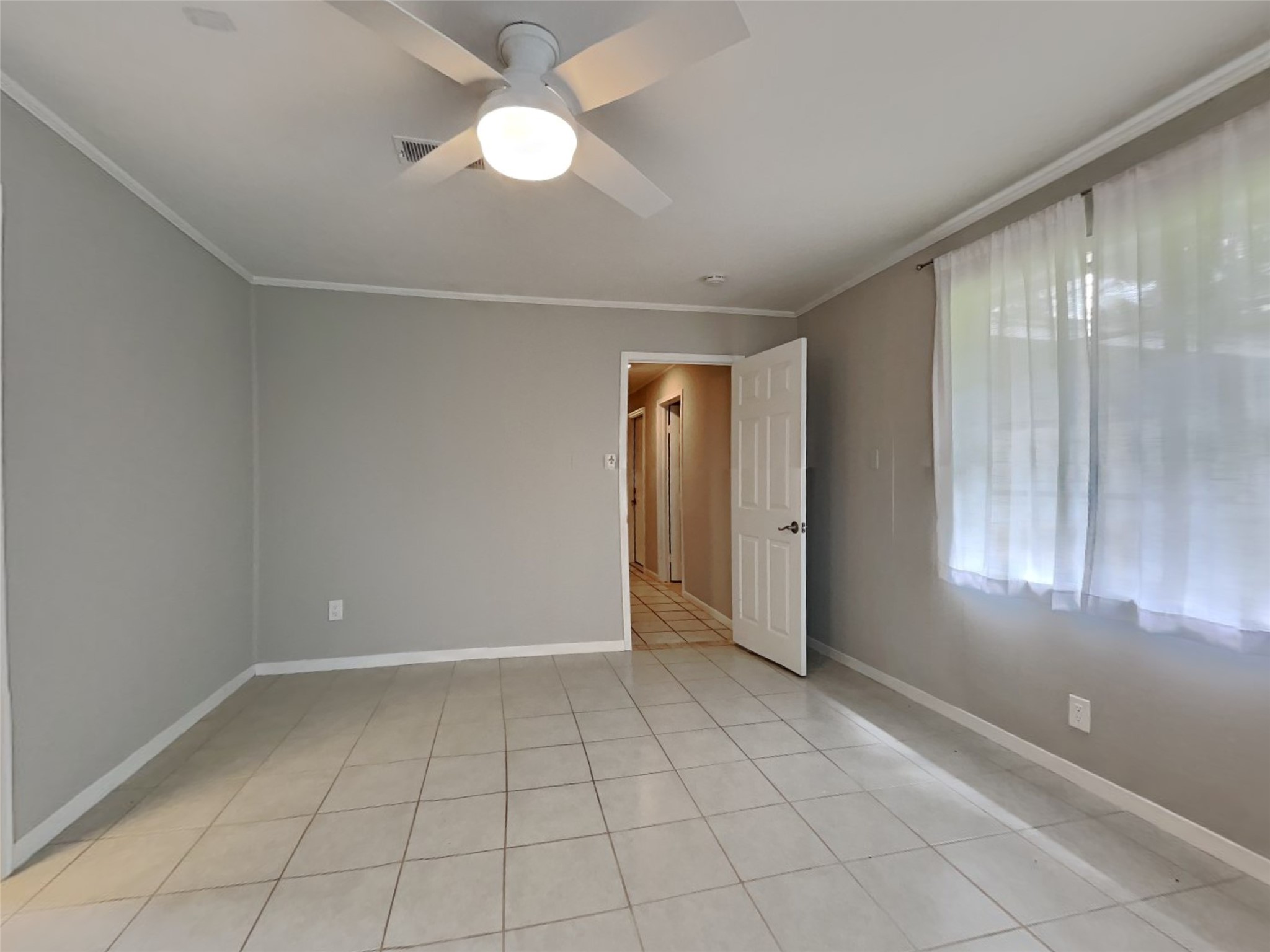 10648 Fussel Road, Unit A Conroe, TX 77385 - Photo 7 of 18 a view of an empty room with a window
