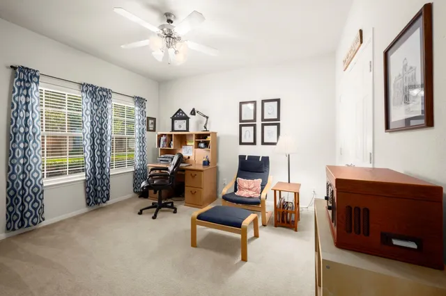 a living room with furniture and a window