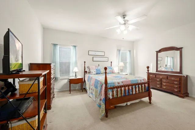 a bed room with furniture and a window