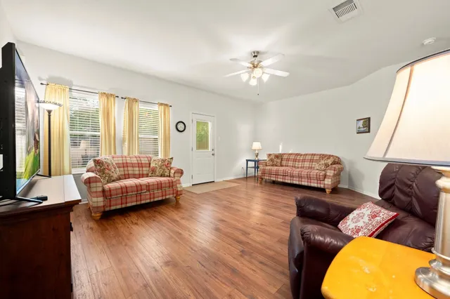 a living room with furniture and a large window