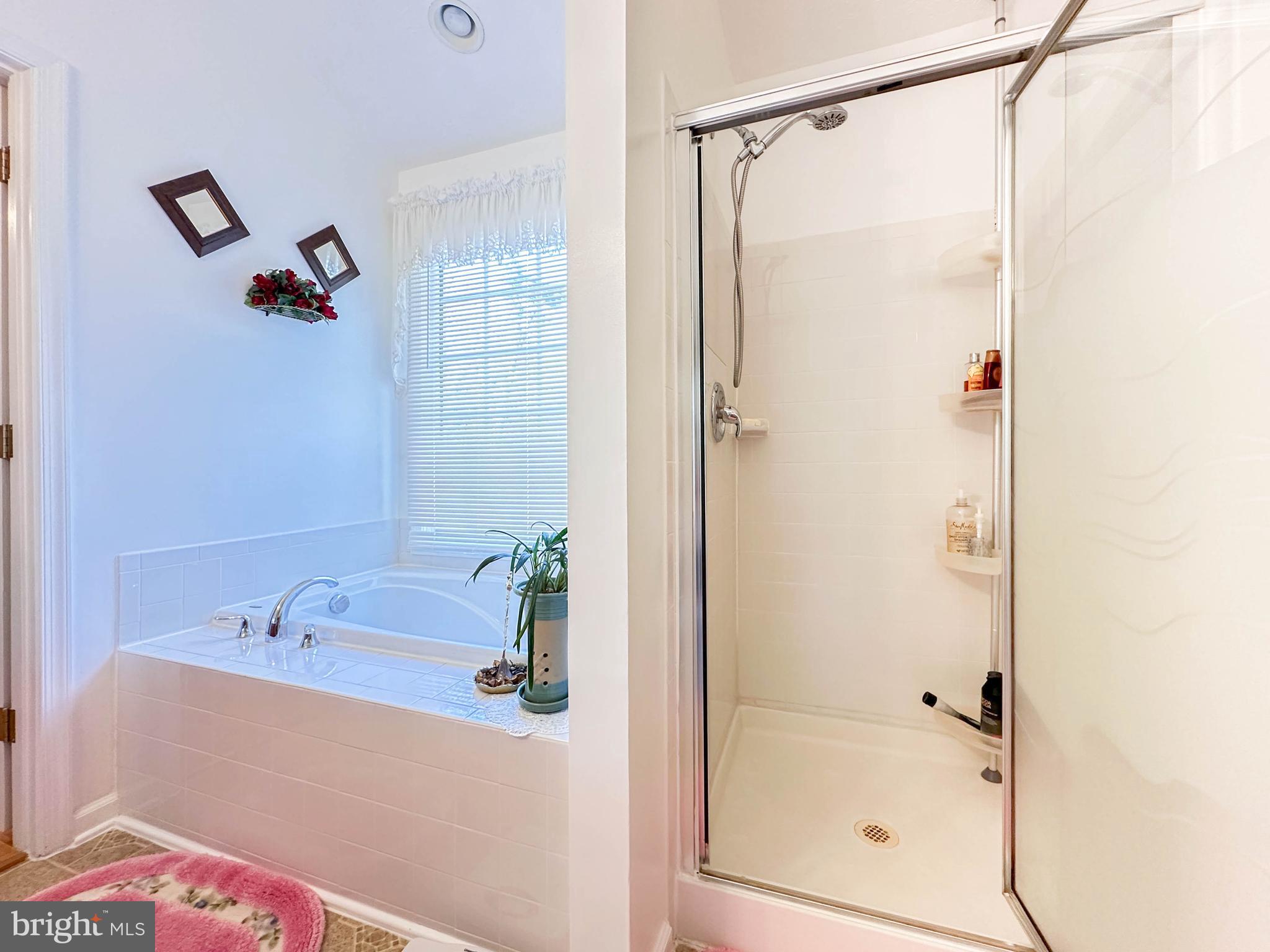 3206 Shadow Park Drive Laurel, MD 20724 - Photo 13 of 28 a bathroom with a shower and a bath tub