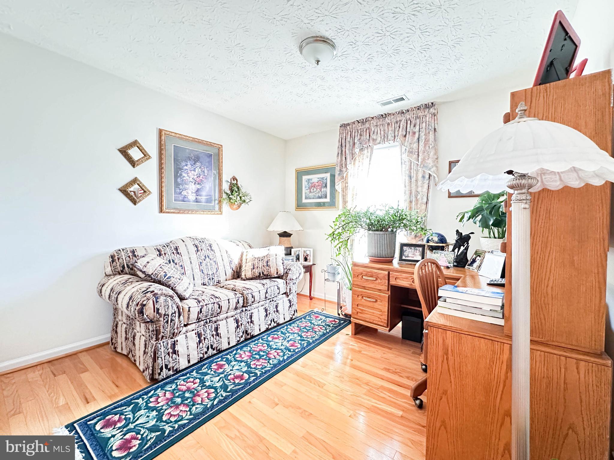 3206 Shadow Park Drive Laurel, MD 20724 - Photo 16 of 28 a living room with furniture and a couch