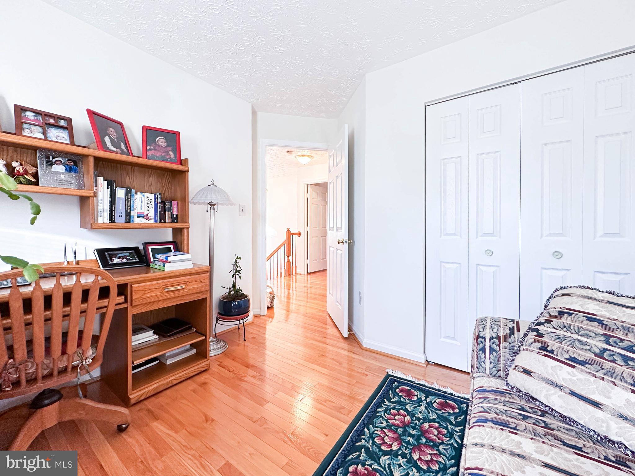 3206 Shadow Park Drive Laurel, MD 20724 - Photo 17 of 28 a bedroom with furniture and a book shelf