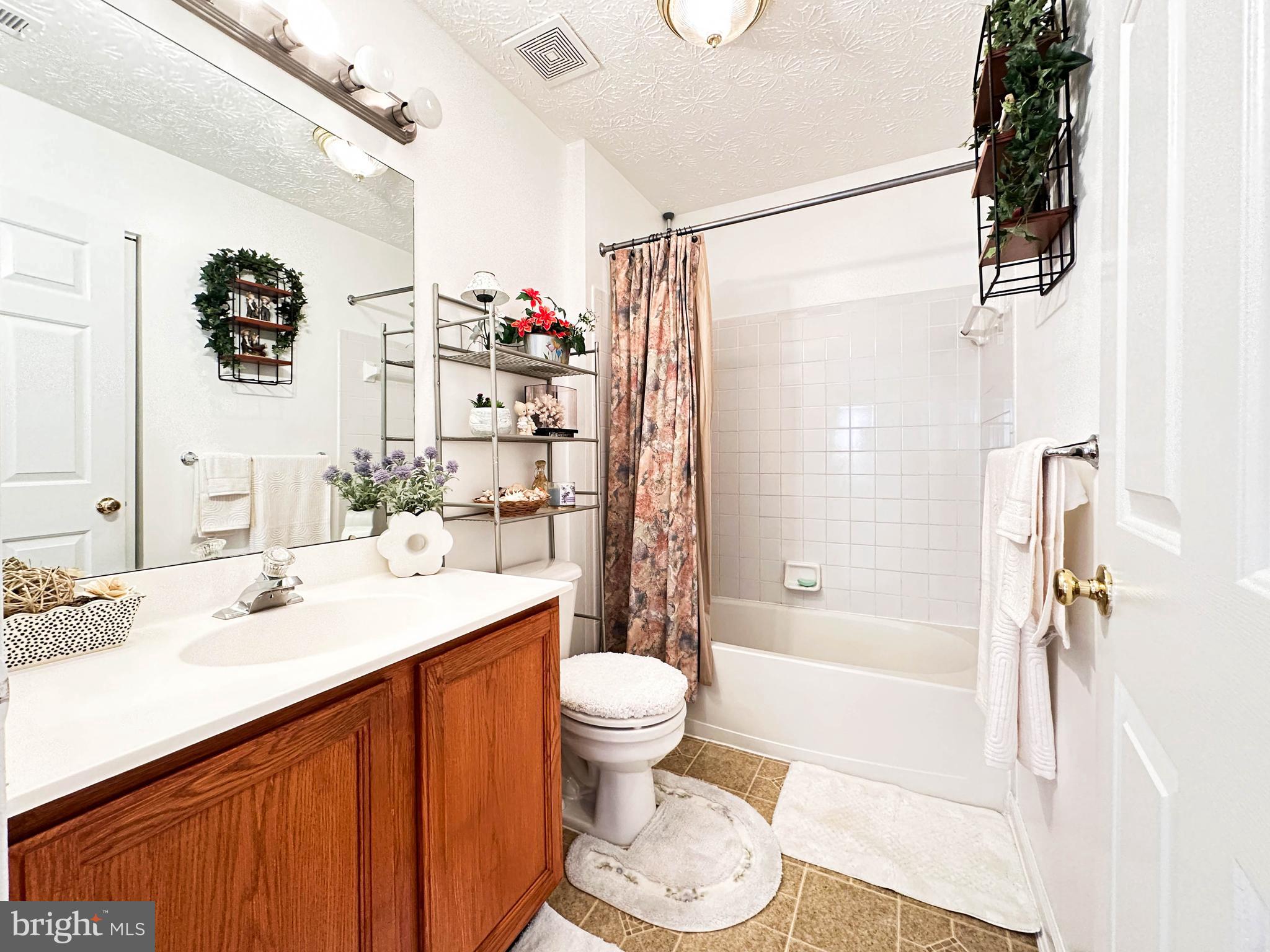 3206 Shadow Park Drive Laurel, MD 20724 - Photo 18 of 28 a bathroom with a sink a toilet and shower