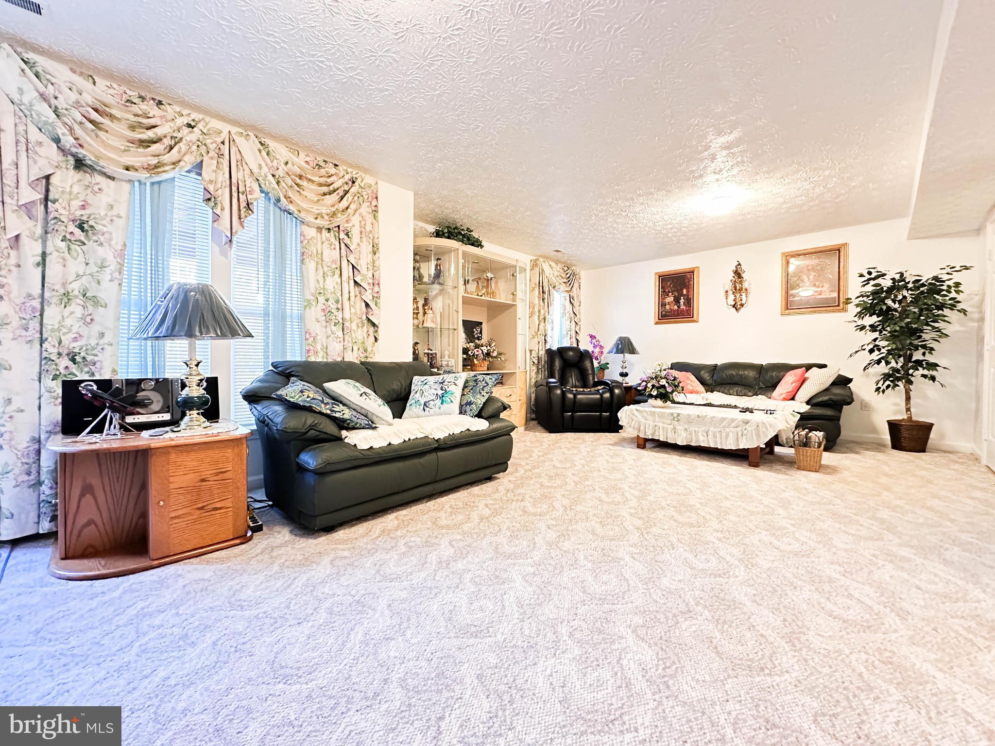 3206 Shadow Park Drive Laurel, MD 20724 - Photo 21 of 28 a living room with furniture and a large window