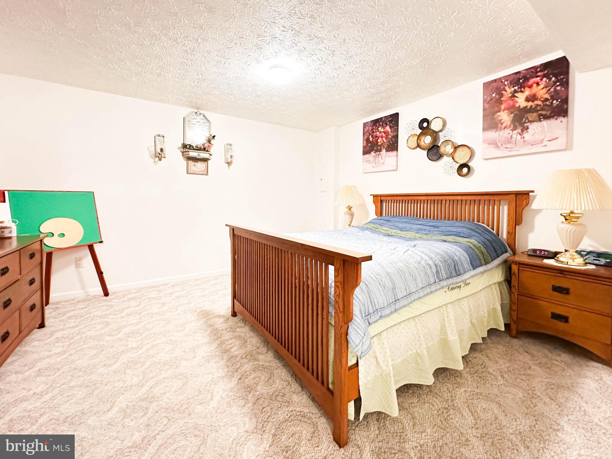 3206 Shadow Park Drive Laurel, MD 20724 - Photo 22 of 28 a bedroom with a bed and a lamp on dresser