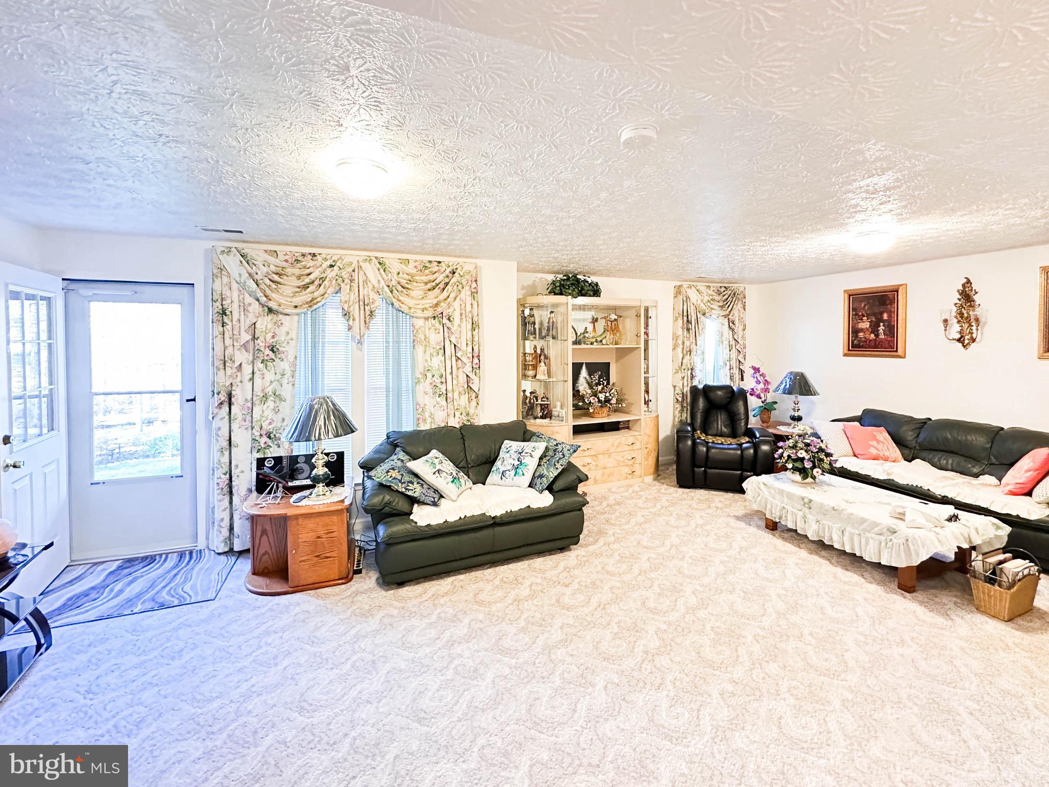 3206 Shadow Park Drive Laurel, MD 20724 - Photo 25 of 28 a living room with furniture window and a table