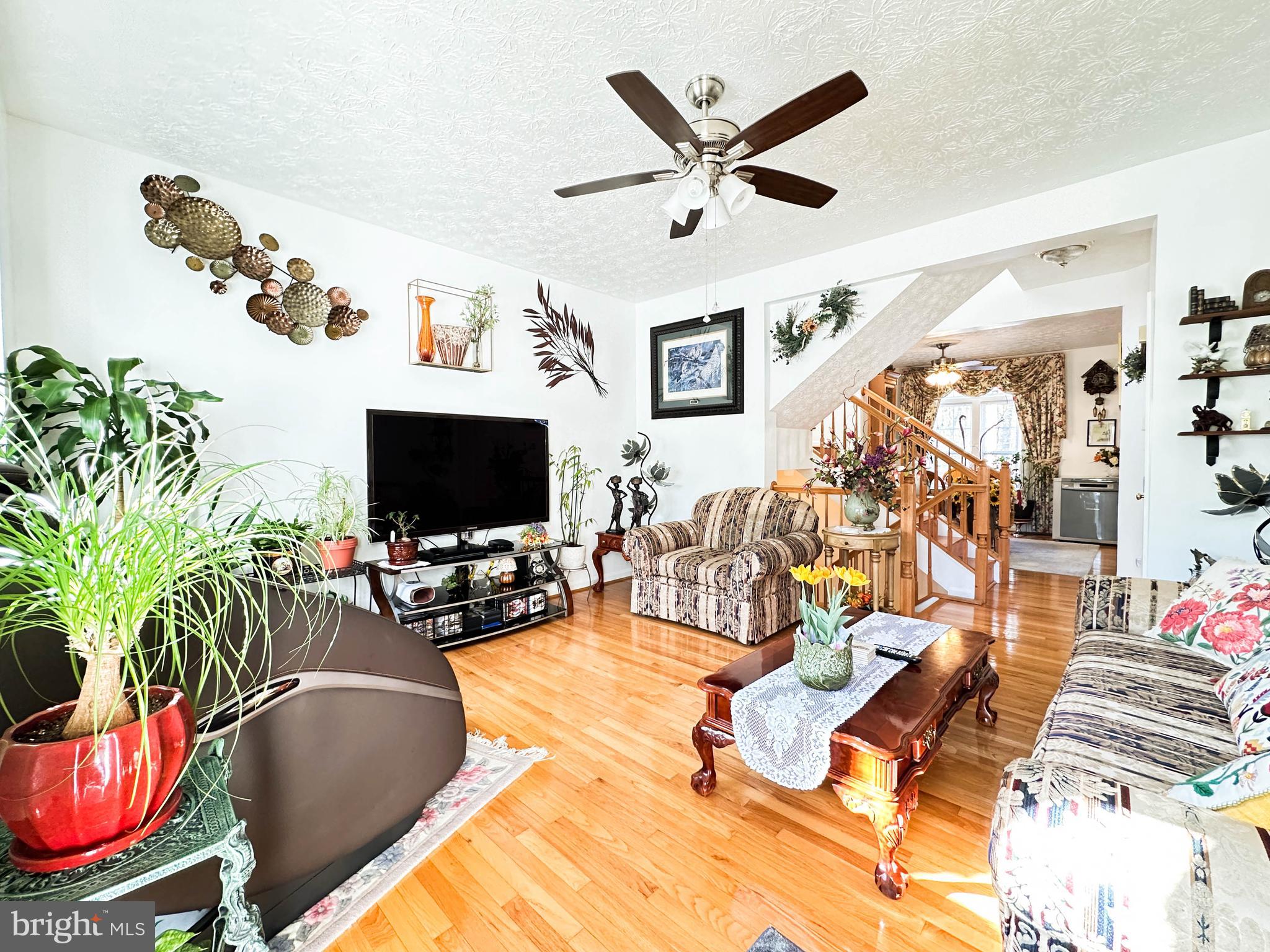 3206 Shadow Park Drive Laurel, MD 20724 - Photo 5 of 28 a living room with furniture and a flat screen tv