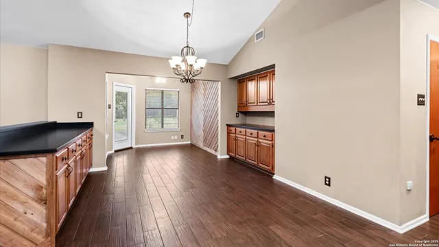 a view of a kitchen island wooden floor and windows