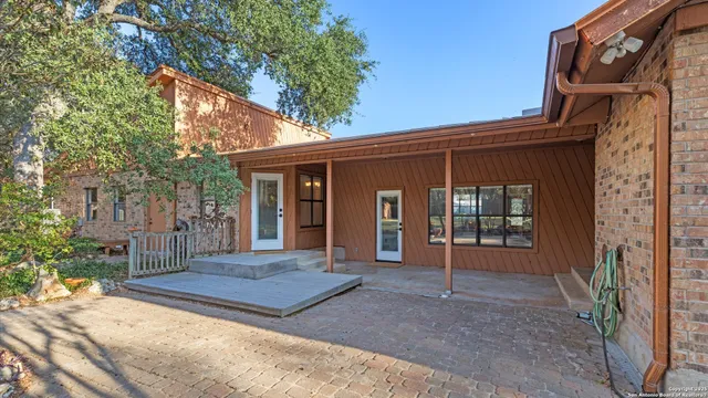 a view of a yard with a house in the background